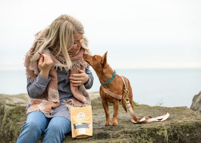 woman giving dog treats in Toronto