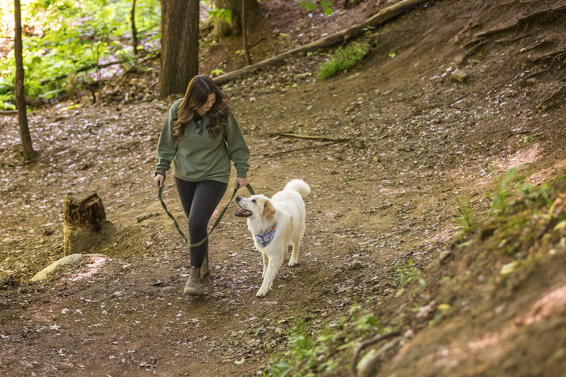 woman and dog in forest