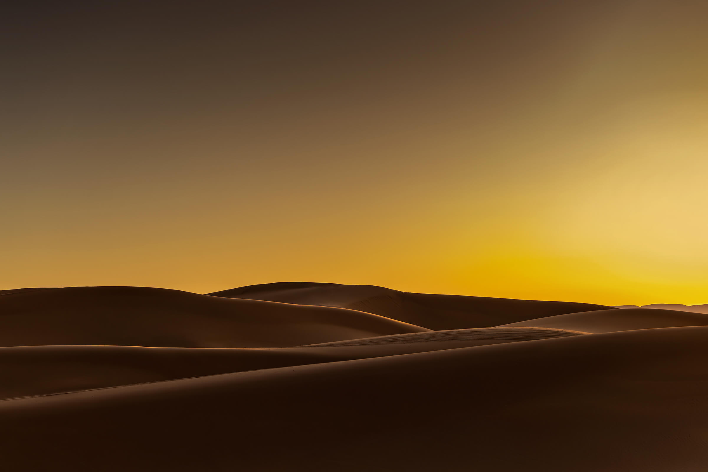 Lone person on the dunes of the Sahara in Morocco